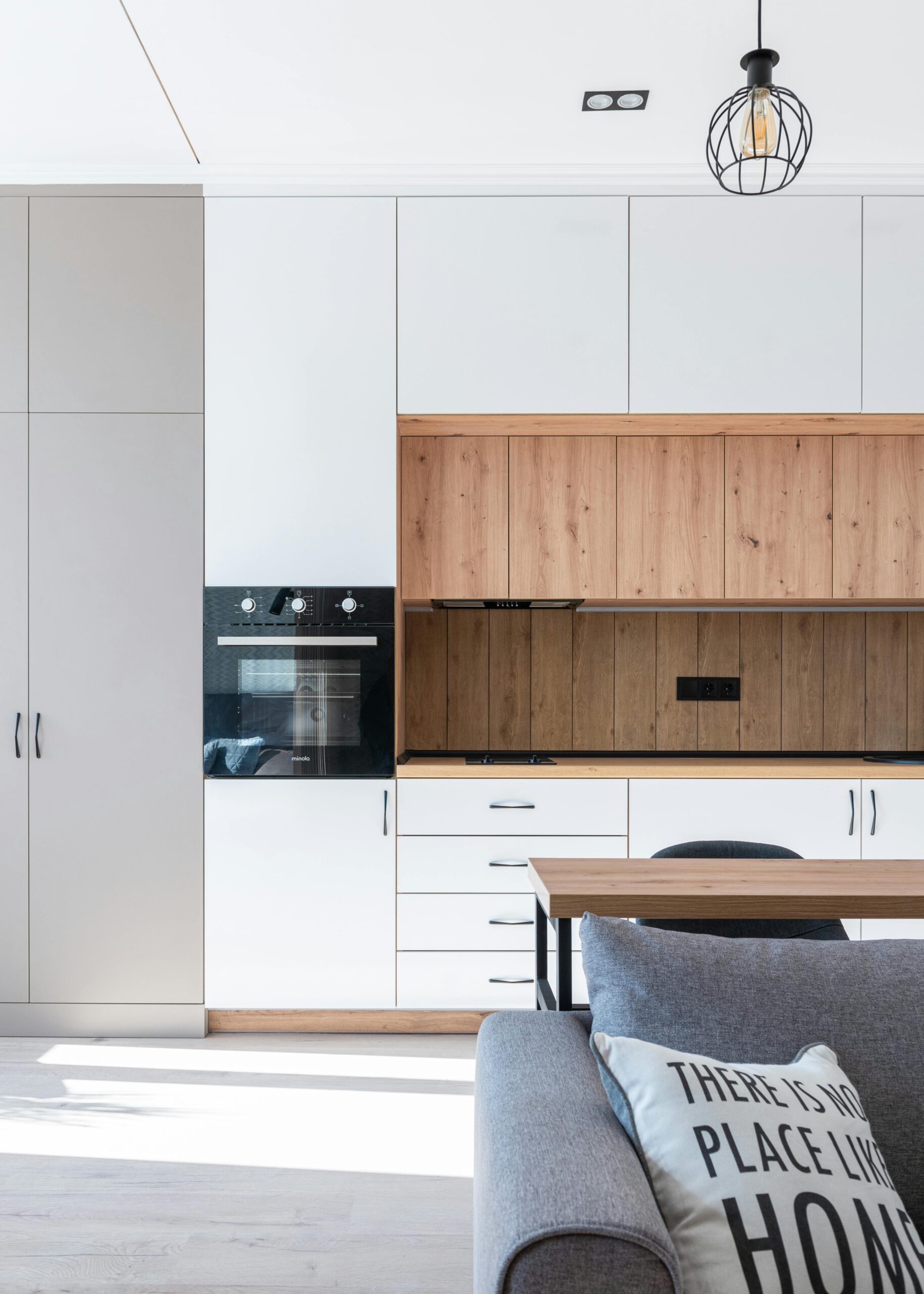 Bright, modern kitchen interior with minimalist design and wooden accents. Ideal for contemporary home inspiration.
